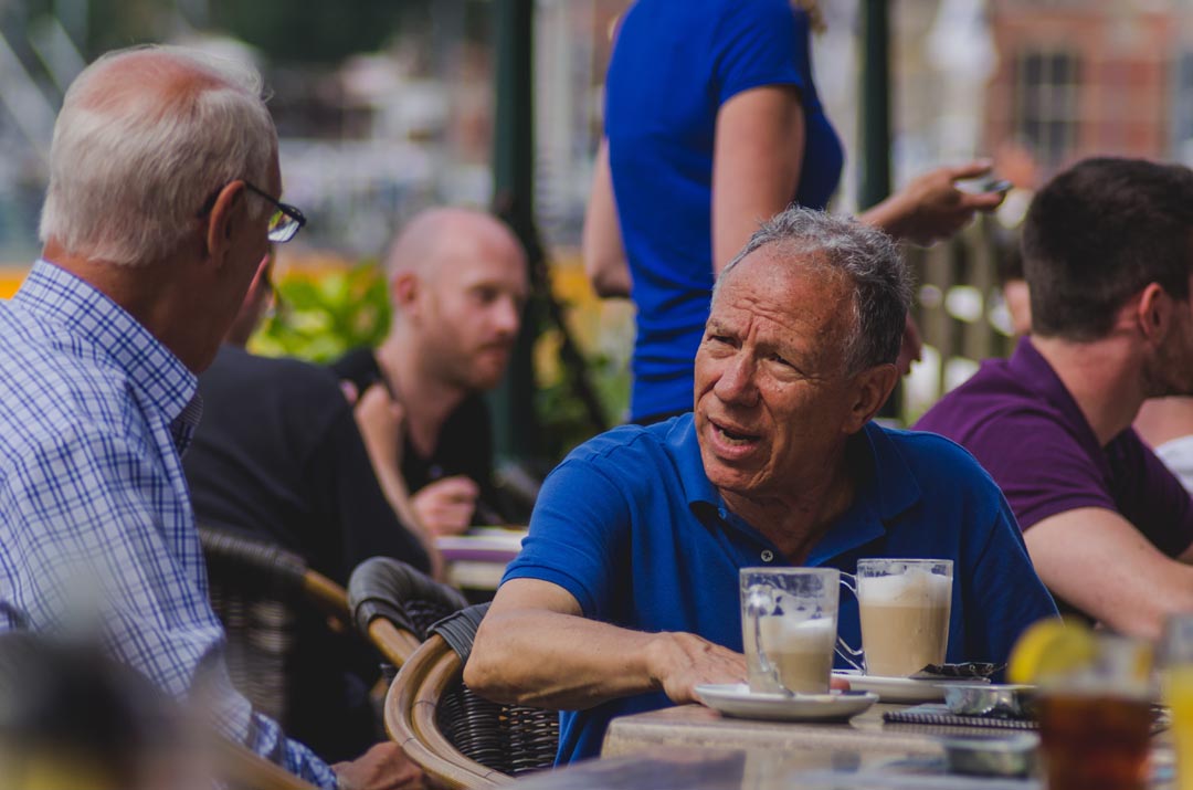 Older men drinking coffee